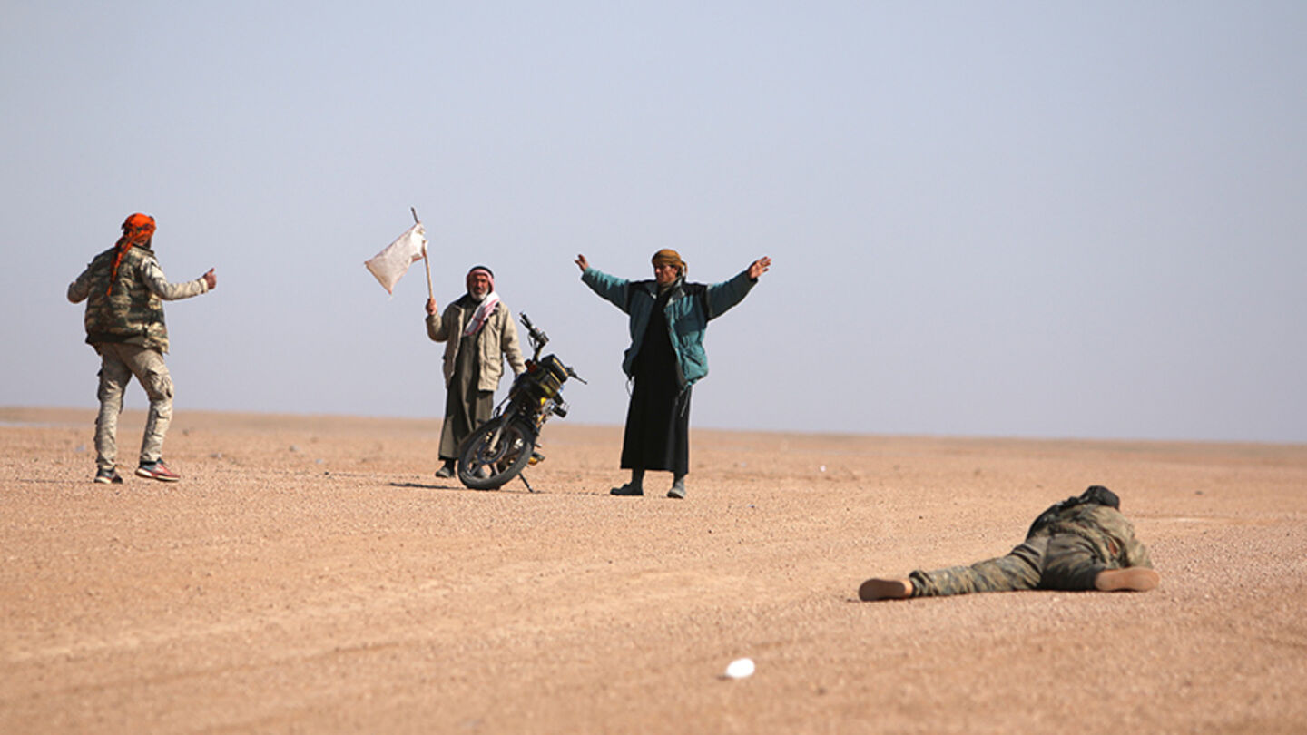 Men that fled areas of clashes surrender to Syrian Democratic Forces(SDF) fighters north of Raqqa city, Syria March 8, 2017. REUTERS/Rodi Said - RTS12102